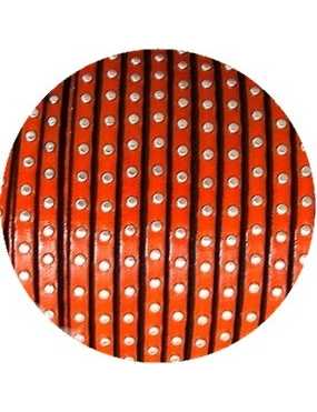 Cuir plat de 5mm orange avec des clous argent vendu au cm